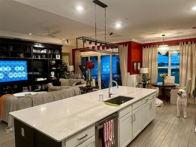 799 Hookline Cir, Loxahatchee, FL 33470 - kitchen with white cabinetry, stainless steel dishwasher, ornamental molding, light stone counters, and pendant lighting