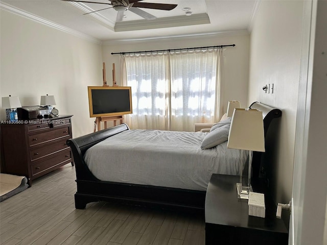 799 Hookline Cir, Loxahatchee, FL 33470 - bedroom featuring wood finished floors, ornamental molding, a raised ceiling, and a ceiling fan