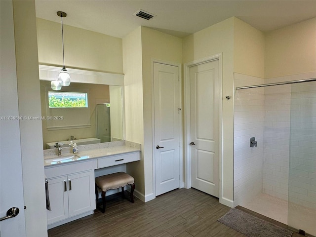 799 Hookline Cir, Loxahatchee, FL 33470 - bathroom featuring a walk in shower, wood finished floors, and vanity