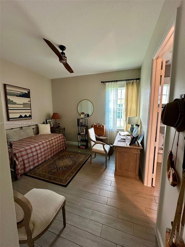 799 Hookline Cir, Loxahatchee, FL 33470 - bedroom featuring wood tiled floors and a ceiling fan
