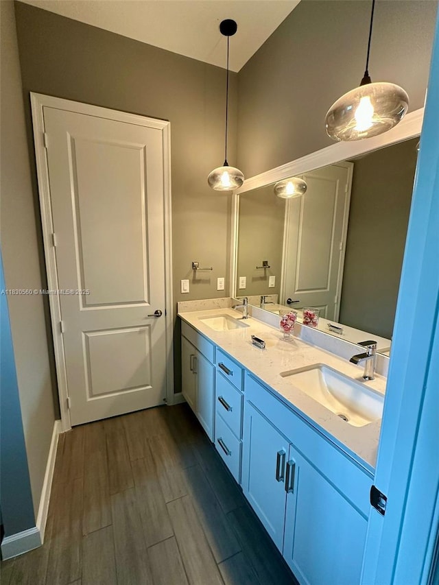 799 Hookline Cir, Loxahatchee, FL 33470 - bathroom featuring double vanity and wood finished floors