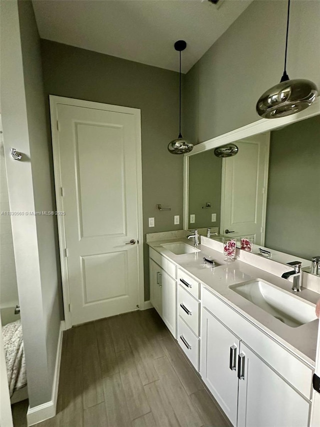 799 Hookline Cir, Loxahatchee, FL 33470 - full bathroom featuring double vanity and wood finished floors