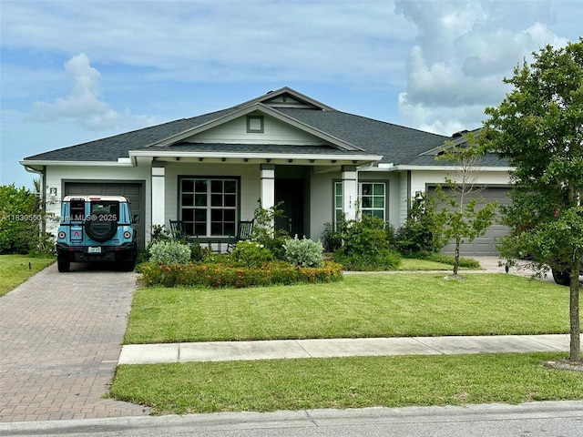 799 Hookline Cir, Loxahatchee, FL 33470 - ranch-style home featuring a garage, decorative driveway, roof with shingles, and a front yard