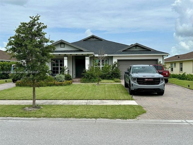 799 Hookline Cir, Loxahatchee, FL 33470 - ranch-style house featuring decorative driveway, a front yard, a garage, and a shingled roof