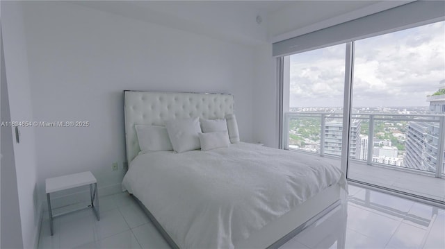1080 Brickell Ave Unit 4209, Miami, FL 33131 - bedroom with light tile patterned floors and a city view
