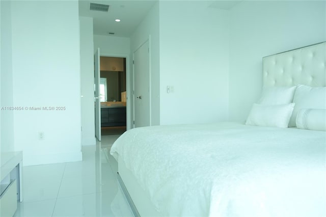 1080 Brickell Ave Unit 4209, Miami, FL 33131 - bedroom with light tile patterned floors and recessed lighting