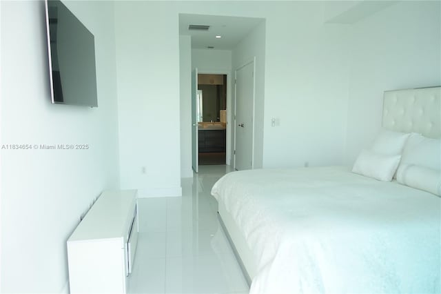 1080 Brickell Ave Unit 4209, Miami, FL 33131 - bedroom featuring light tile patterned floors and ensuite bath