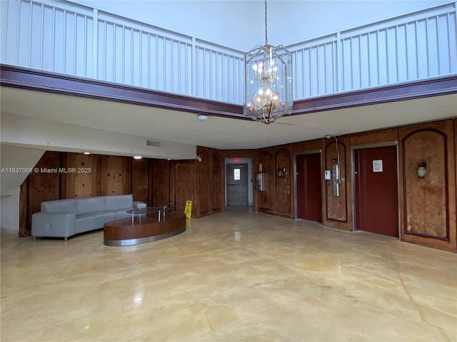 2025 NE 164th St Unit 807, North Miami Beach, FL 33162 - common area with a high ceiling and wood walls