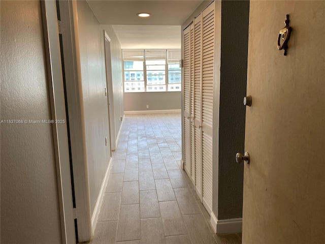 2025 NE 164th St Unit 807, North Miami Beach, FL 33162 - corridor featuring light tile patterned flooring and recessed lighting
