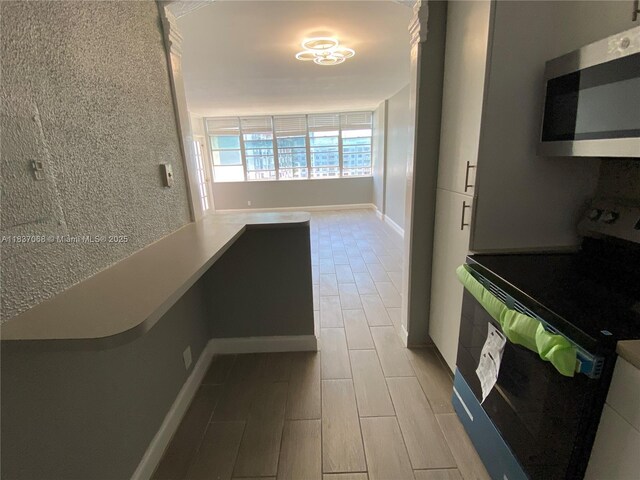 2025 NE 164th St Unit 807, North Miami Beach, FL 33162 - hall with light wood-style floors