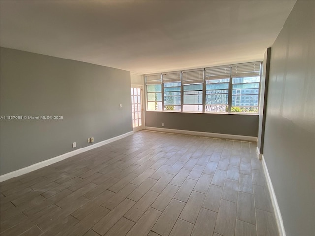 2025 NE 164th St Unit 807, North Miami Beach, FL 33162 - spare room featuring dark wood finished floors and baseboards