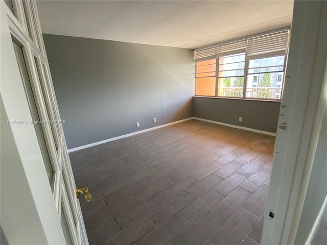 2025 NE 164th St Unit 807, North Miami Beach, FL 33162 - unfurnished room with dark wood finished floors and baseboards