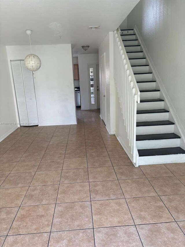 2050 NE 167th St Unit 3-124, North Miami Beach, FL 33162 - staircase featuring tile patterned flooring