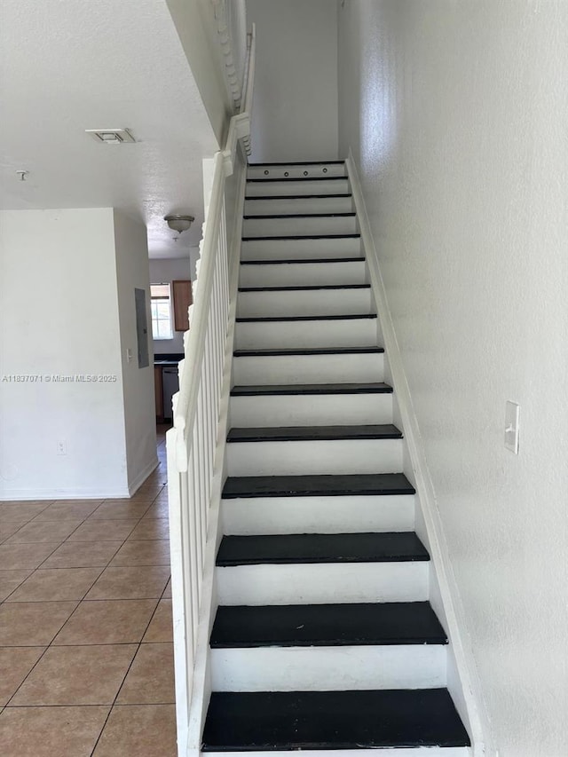 2050 NE 167th St Unit 3-124, North Miami Beach, FL 33162 - stairway with tile patterned flooring and baseboards