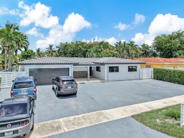 11055 NW 59th Ct, Hialeah, FL 33012 - ranch-style home featuring a tiled roof and stucco siding
