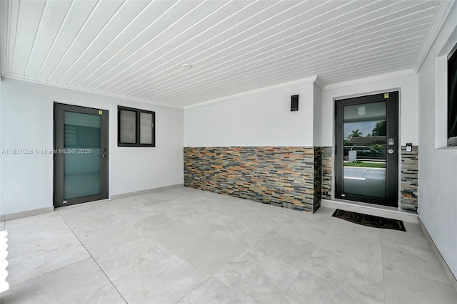 11055 NW 59th Ct, Hialeah, FL 33012 - entrance to property with stucco siding, a patio, and stone siding