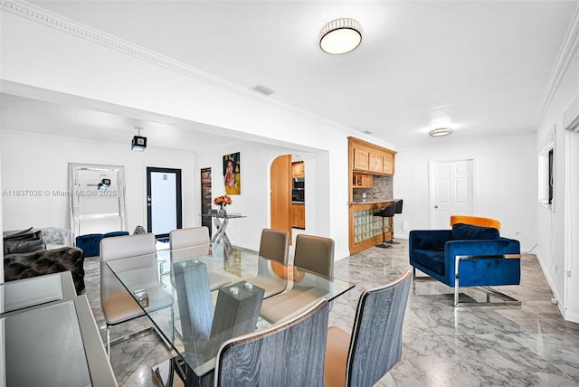 11055 NW 59th Ct, Hialeah, FL 33012 - dining area with light marble finish flooring, arched walkways, and ornamental molding