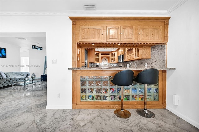 11055 NW 59th Ct, Hialeah, FL 33012 - kitchen with marble finish floors, tasteful backsplash, glass insert cabinets, ornamental molding, and light stone countertops