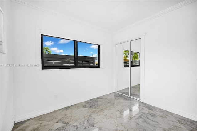 11055 NW 59th Ct, Hialeah, FL 33012 - unfurnished bedroom featuring marble finish flooring, crown molding, and a closet