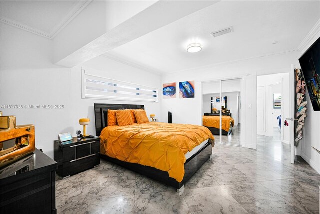 11055 NW 59th Ct, Hialeah, FL 33012 - bedroom featuring crown molding, marble tiled flooring, and a closet