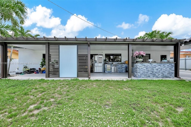 11055 NW 59th Ct, Hialeah, FL 33012 - rear view of house with a patio area