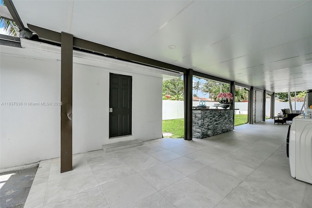 11055 NW 59th Ct, Hialeah, FL 33012 - view of patio featuring washer / dryer