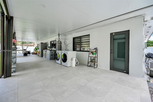 11055 NW 59th Ct, Hialeah, FL 33012 - view of patio / terrace with separate washer and dryer