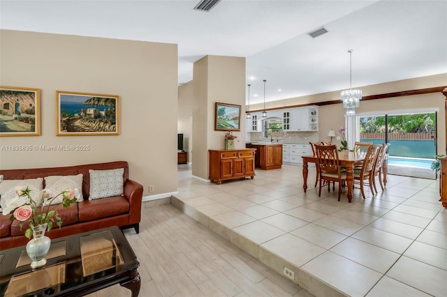 11321 NW 1st Ct, Coral Springs, FL 33071 - dining room featuring a chandelier and baseboards