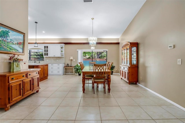 11321 NW 1st Ct, Coral Springs, FL 33071 - dining area featuring a chandelier, plenty of natural light, and light tile patterned floors