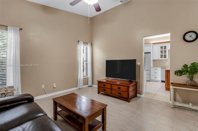 11321 NW 1st Ct, Coral Springs, FL 33071 - living room with a ceiling fan, a high ceiling, and light wood-style flooring