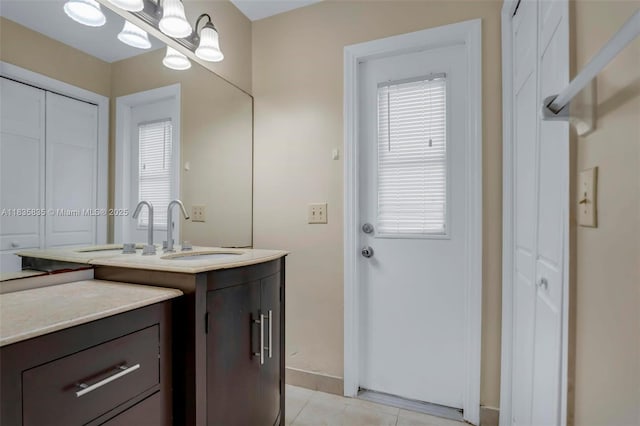 11321 NW 1st Ct, Coral Springs, FL 33071 - bathroom featuring vanity, tile patterned floors, and a chandelier