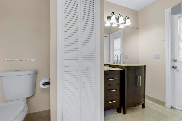11321 NW 1st Ct, Coral Springs, FL 33071 - bathroom featuring a closet, vanity, and tile patterned floors
