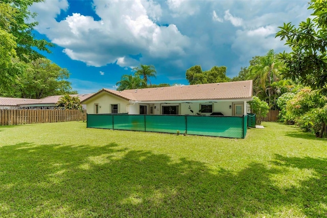 11321 NW 1st Ct, Coral Springs, FL 33071 - back of house with stucco siding, a fenced backyard, and a tiled roof