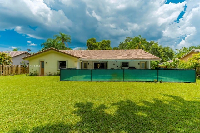 11321 NW 1st Ct, Coral Springs, FL 33071 - back of house with stucco siding, a fenced backyard, ceiling fan, and a tile roof