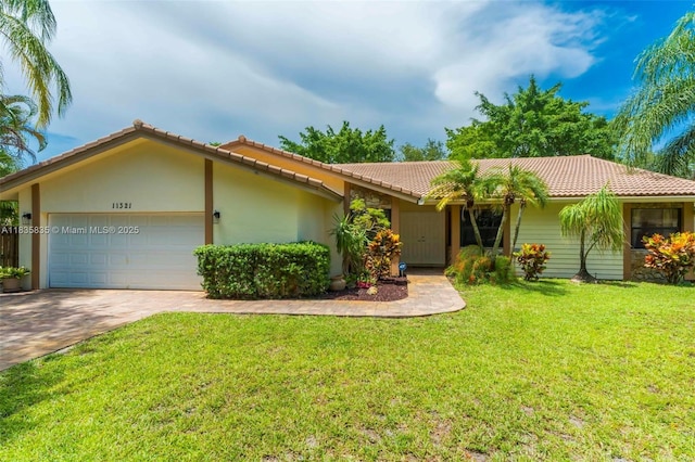 11321 NW 1st Ct, Coral Springs, FL 33071 - ranch-style home featuring a tiled roof, a garage, driveway, a front lawn, and stucco siding