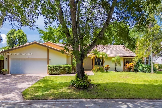 11321 NW 1st Ct, Coral Springs, FL 33071 - ranch-style home featuring a tiled roof, an attached garage, a front lawn, and driveway