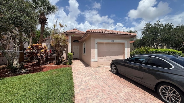 1244 NW 171st Ave, Pembroke Pines, FL 33028 - mediterranean / spanish-style house with stucco siding, a garage, a tiled roof, and decorative driveway