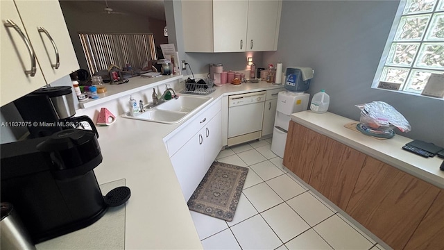 1244 NW 171st Ave, Pembroke Pines, FL 33028 - kitchen featuring white dishwasher, light countertops, light tile patterned floors, and white cabinets