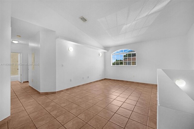 7506 W 20th Ave Unit 206, Hialeah, FL 33016 - unfurnished room featuring tile patterned floors and vaulted ceiling