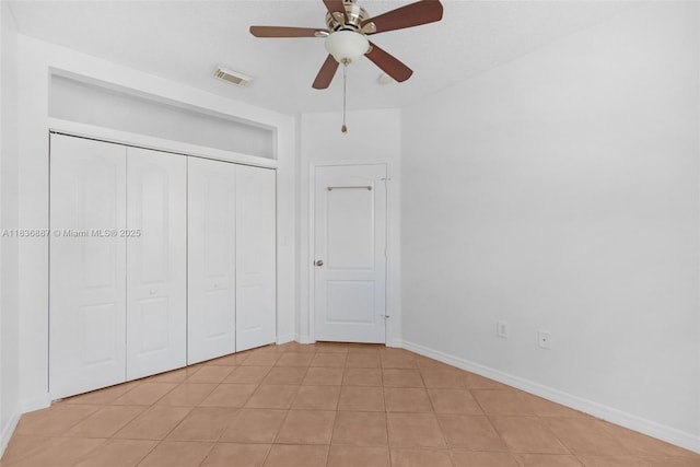 7506 W 20th Ave Unit 206, Hialeah, FL 33016 - unfurnished bedroom featuring a closet, light tile patterned floors, and ceiling fan