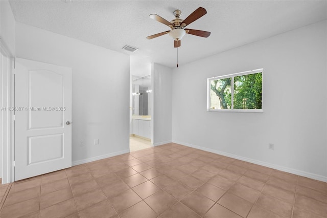 7506 W 20th Ave Unit 206, Hialeah, FL 33016 - tiled spare room with ceiling fan and a textured ceiling