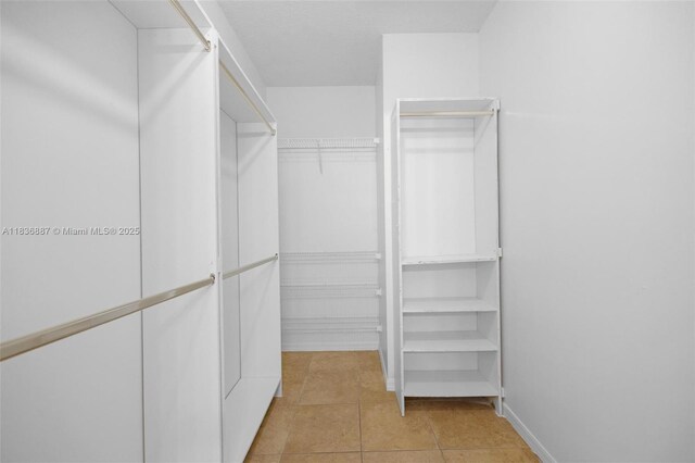 7506 W 20th Ave Unit 206, Hialeah, FL 33016 - walk in closet featuring light tile patterned floors