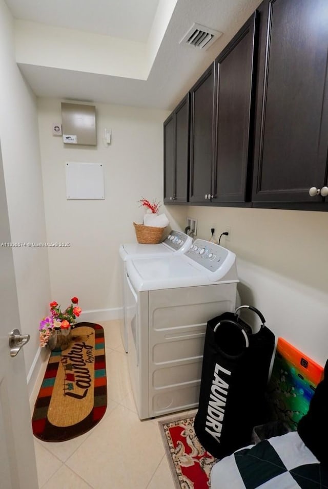 2954 NW 124th Way, Sunrise, FL 33323 - washroom featuring cabinet space, washing machine and dryer, and light tile patterned floors