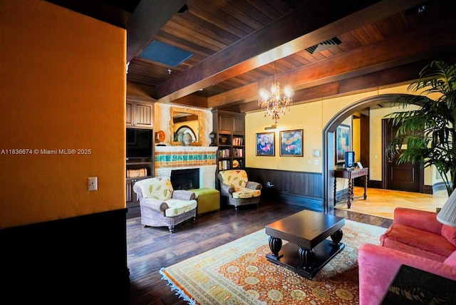 2954 NW 124th Way, Sunrise, FL 33323 - living area with arched walkways, a wood ceiling with exposed beams, a large fireplace, wood finished floors, and a chandelier