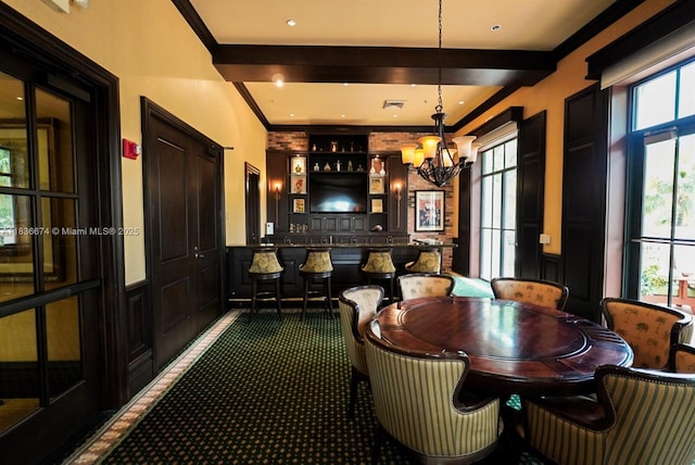 2954 NW 124th Way, Sunrise, FL 33323 - dining room featuring a chandelier, healthy amount of natural light, dark colored carpet, a community bar, and ornamental molding