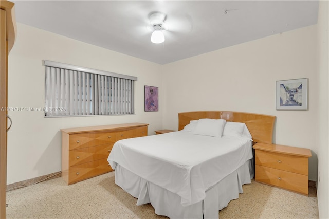 201 NW 14th Ave, Miami, FL 33125 - bedroom featuring dark speckled floor and baseboards