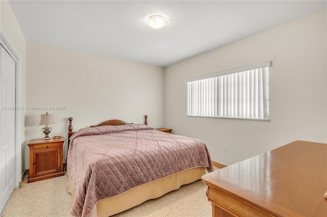 201 NW 14th Ave, Miami, FL 33125 - bedroom featuring dark speckled floor and baseboards