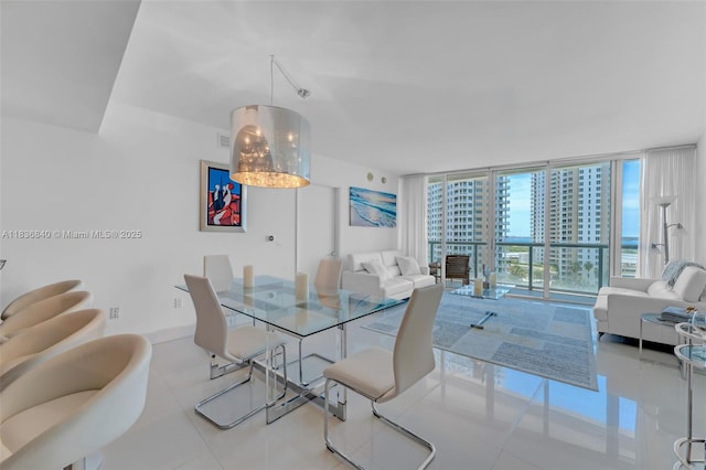 495 Brickell Ave Unit Bay1007, Miami, FL 33131 - dining area featuring a wall of windows and tile patterned flooring