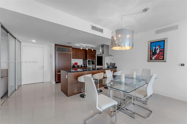 495 Brickell Ave Unit Bay1007, Miami, FL 33131 - dining area featuring baseboards and light tile patterned flooring