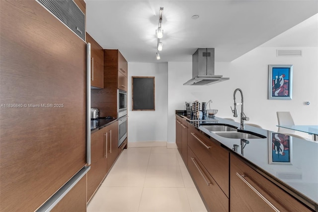 495 Brickell Ave Unit Bay1007, Miami, FL 33131 - kitchen featuring modern cabinets, exhaust hood, dark countertops, high quality fridge, and light tile patterned flooring